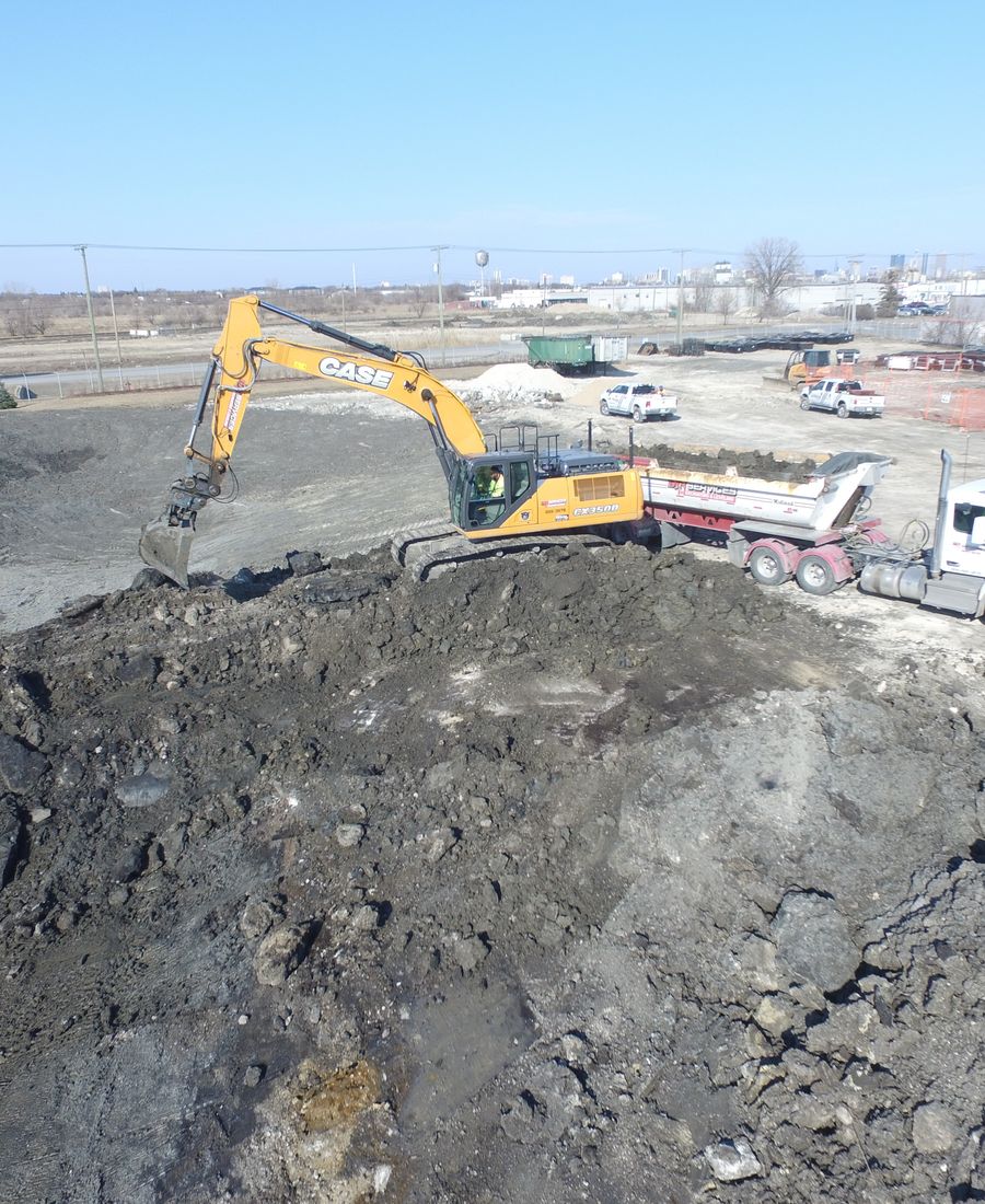 DJN excavator loading an end dump truck