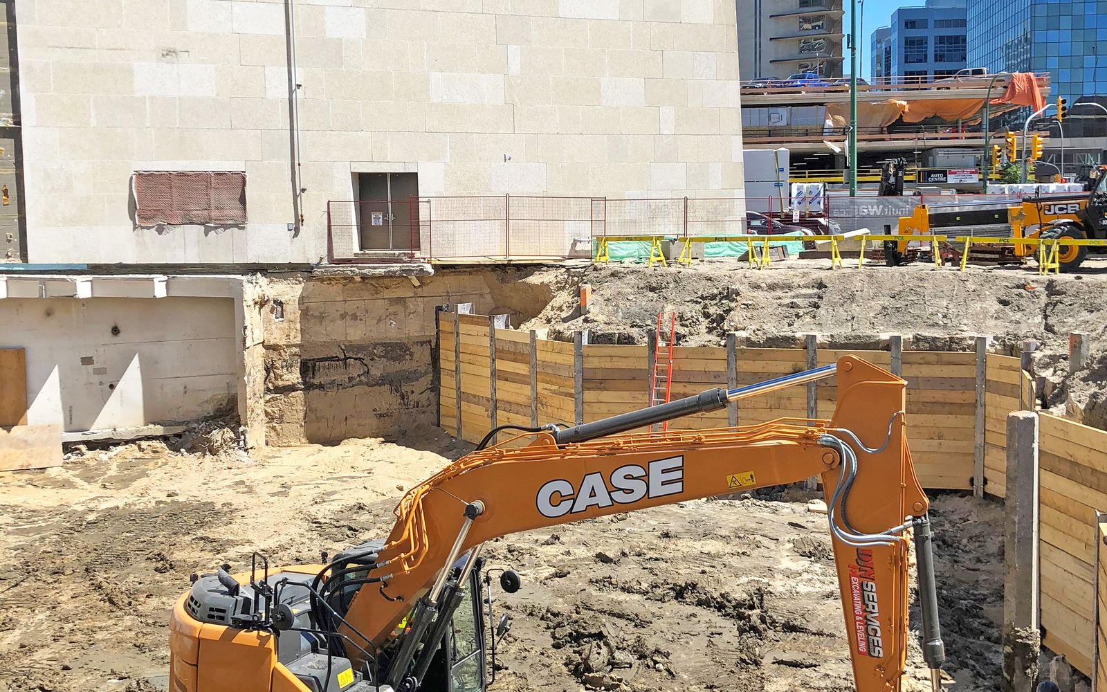 DJN excavator in a shored excavation in downtown Winnipeg